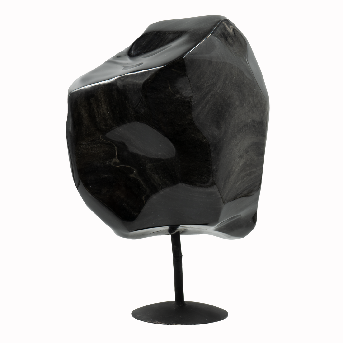 A large polished obsidian stone on a stand, with a silver sheen appearance.