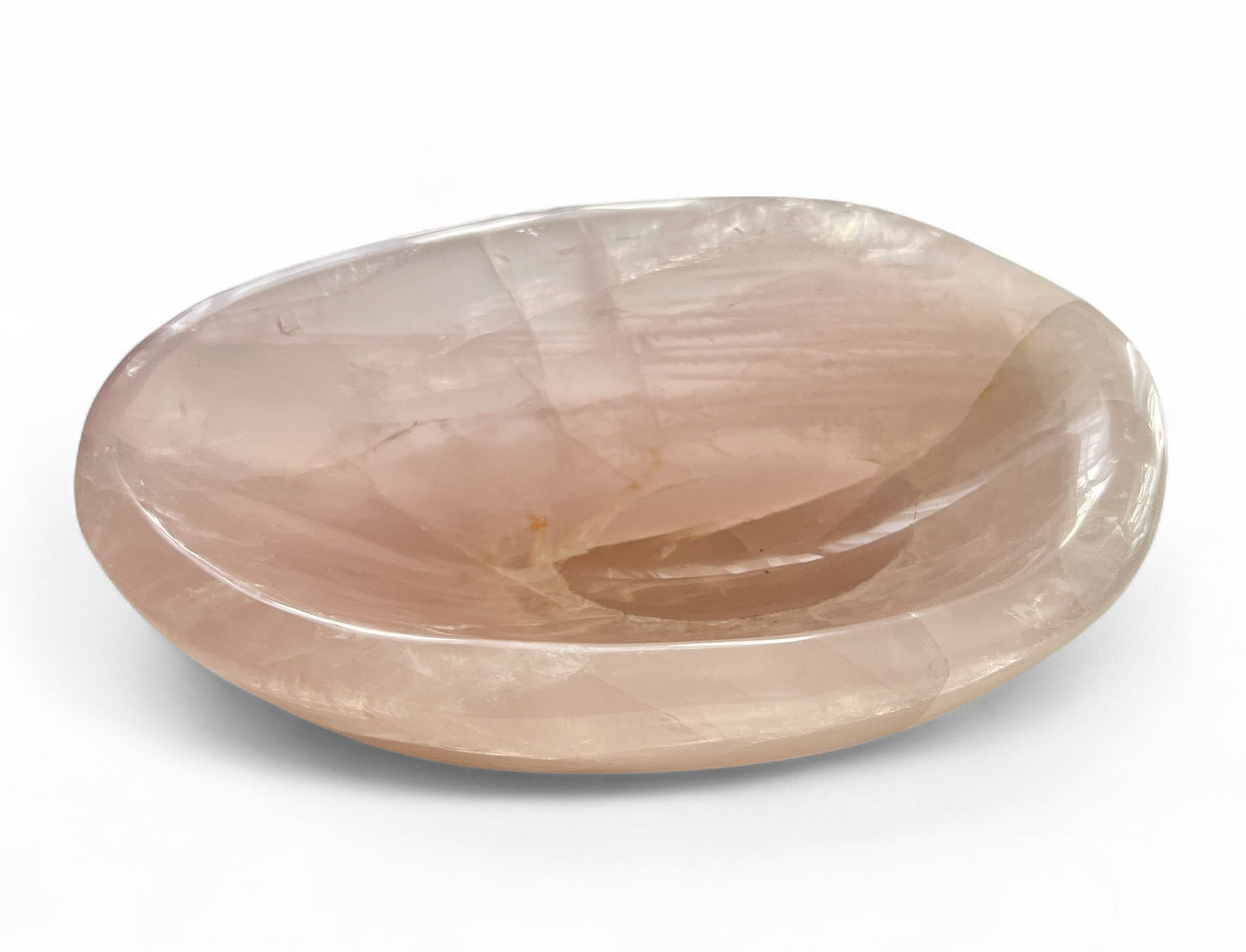 Rose quartz polished crystal bowl on a white background