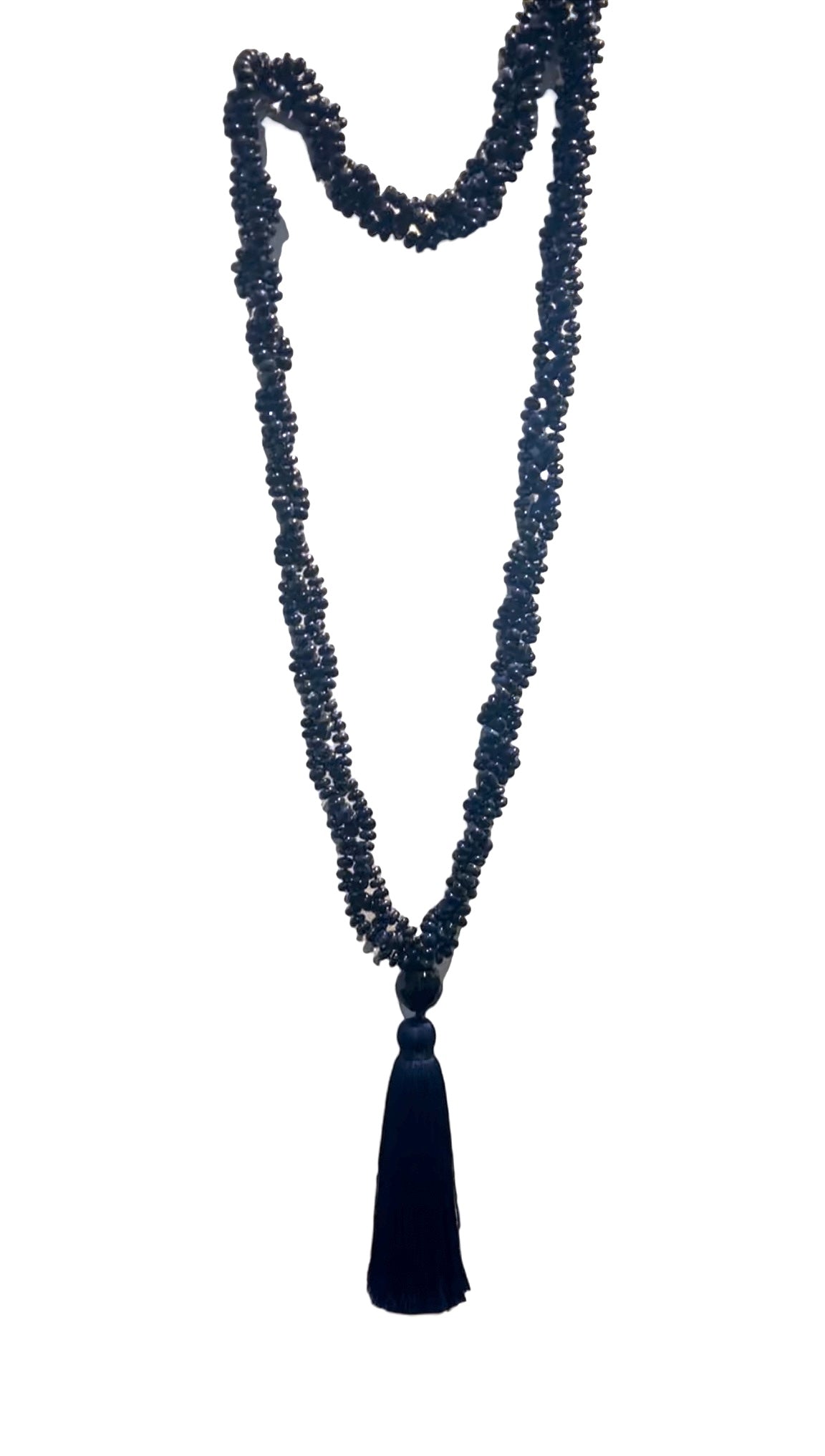 Long lapis lazuli mala necklace with dark blue gemstone beads and a black tassel, designed for wall decor.
