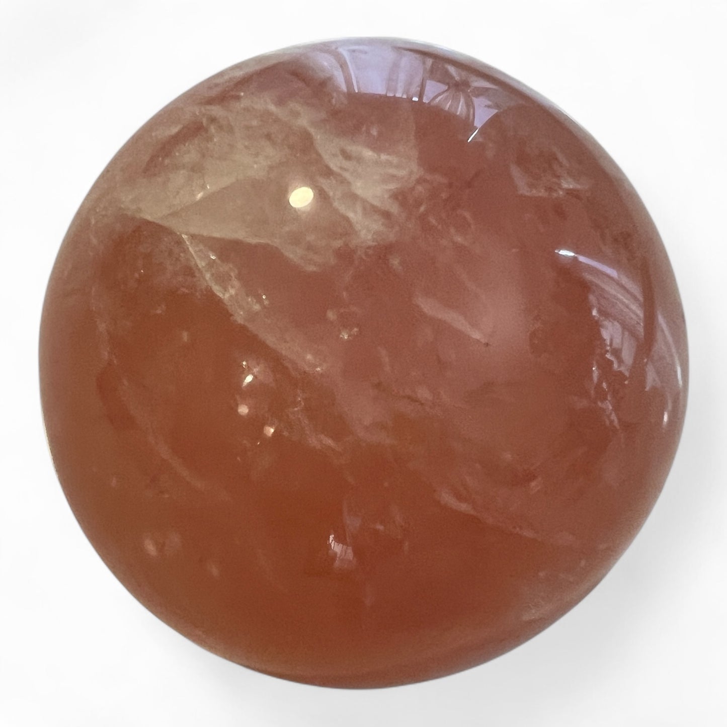 Pink crystal sphere on a white background