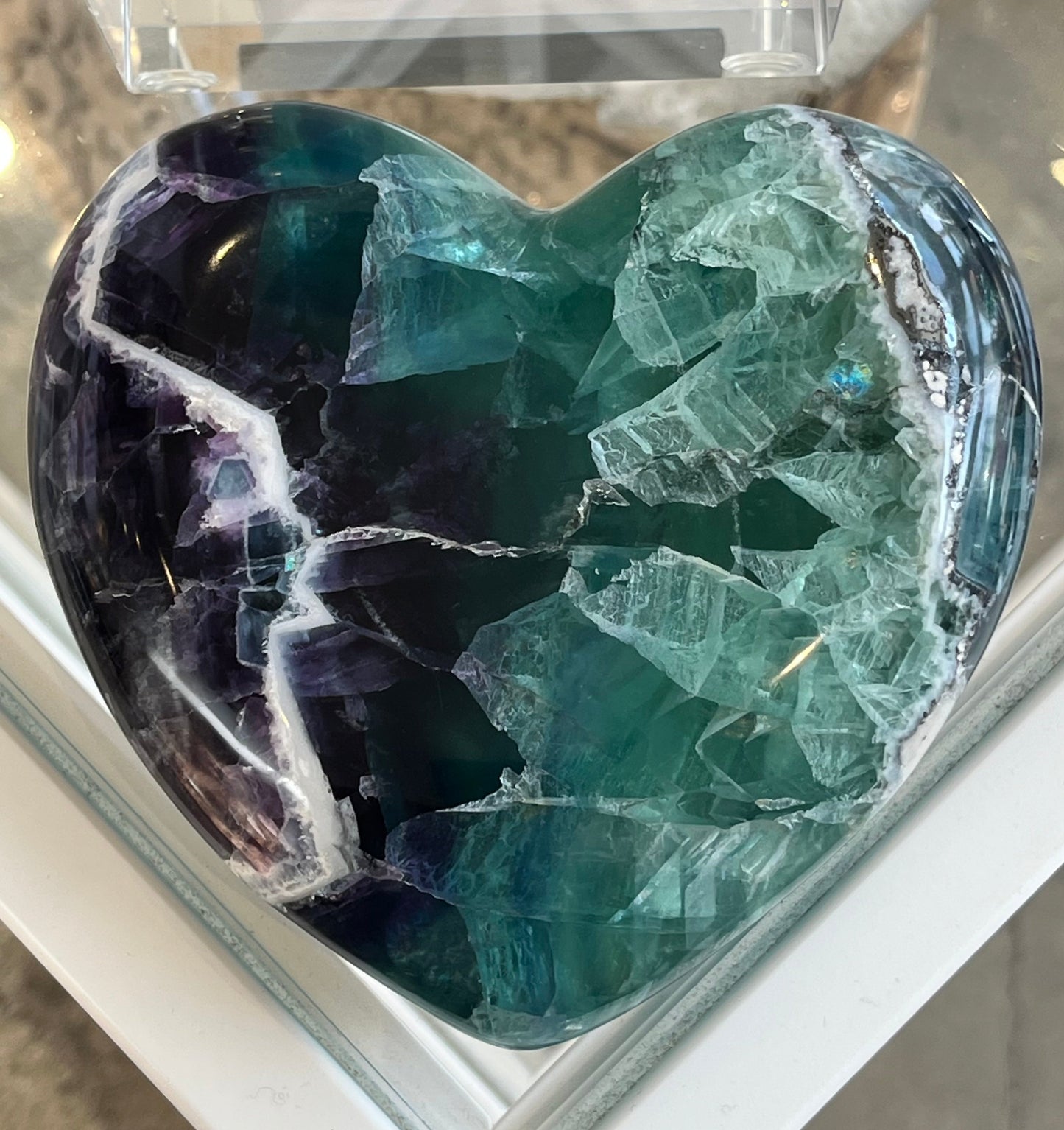 large fluorite crystal heart with great swaths of green and purple and a beautiful white vein