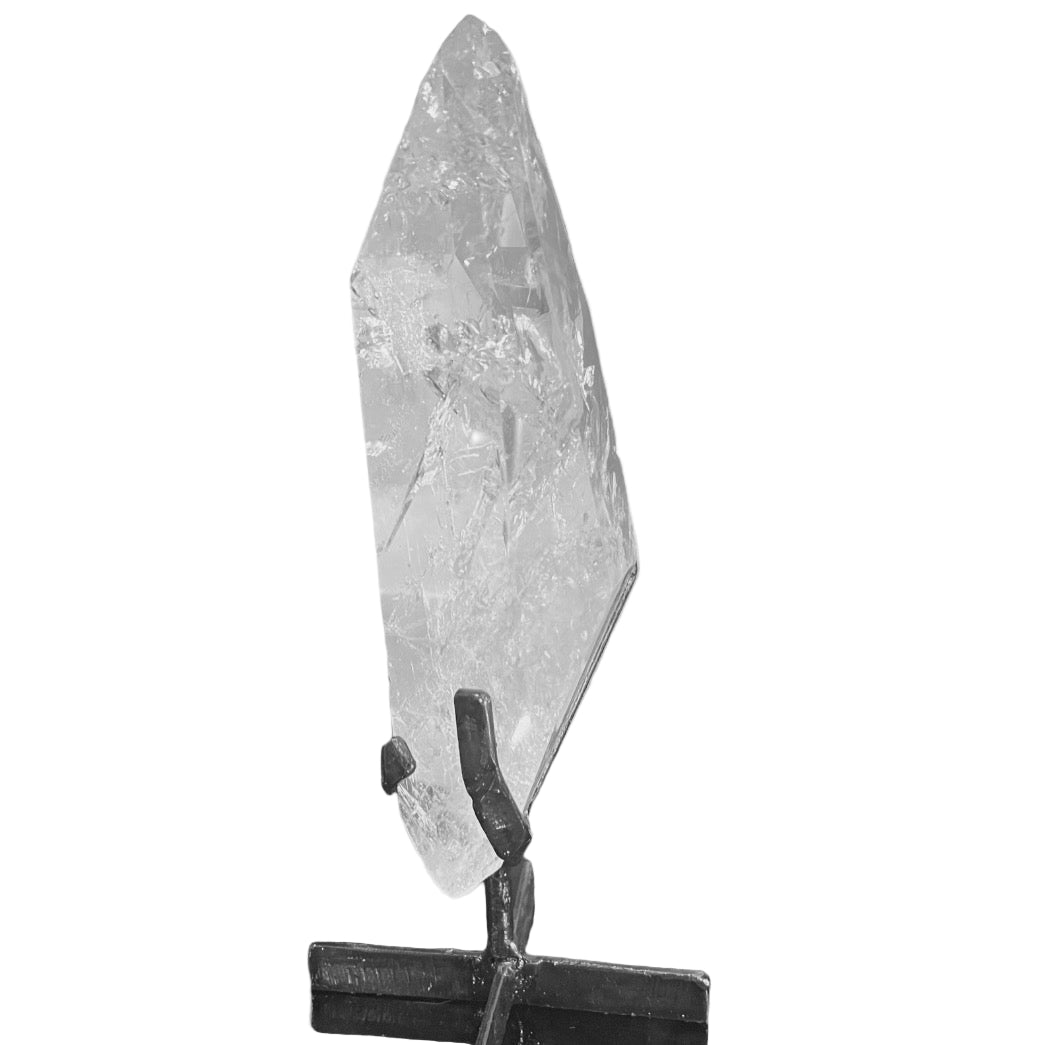 A Lemurian Quartz crystal mounted on a black stand against a white background.