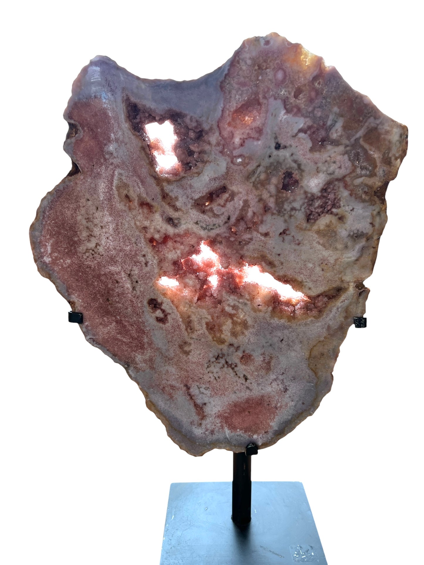 A pink amethyst slab displayed on a stand, showcasing its rough, textured surface with areas of purple and pink coloring.
