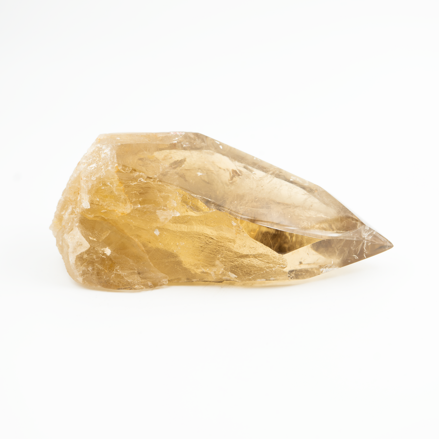 A polished citrine crystal with a flat point cut, displaying a yellow color, against a white background.