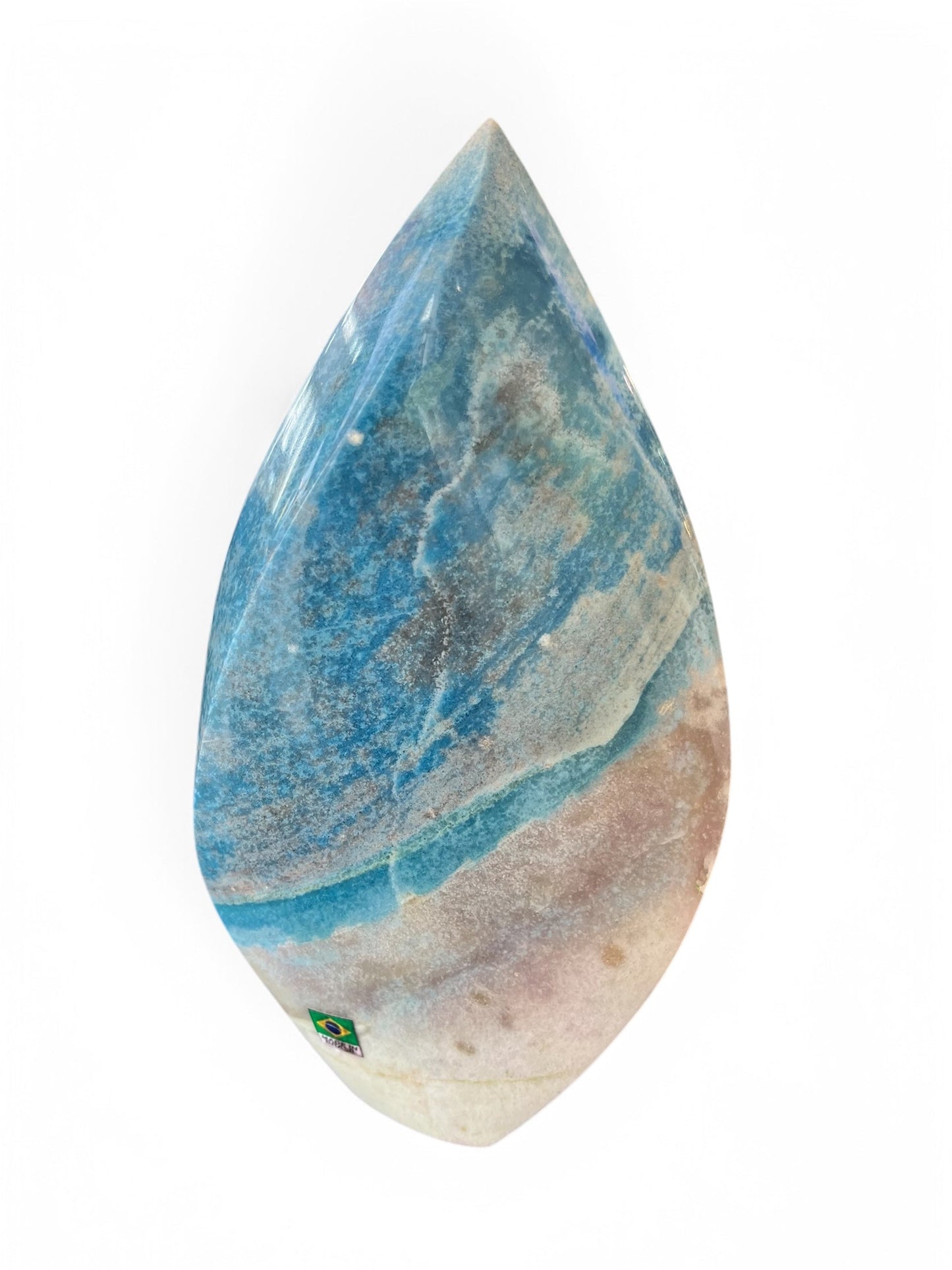 A teardrop-shaped trolleite mineral with blue and white patterns, polished on both sides, against a white background.