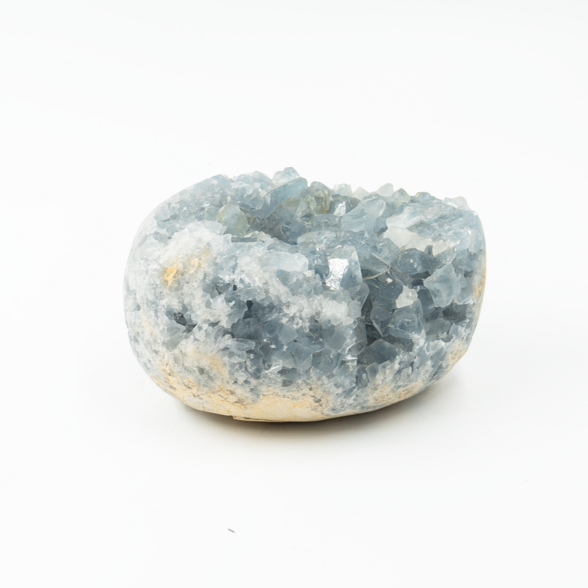 A rough, egg-shaped Celestite crystal on a white background, viewed from the top showing the intricate natural patterns.