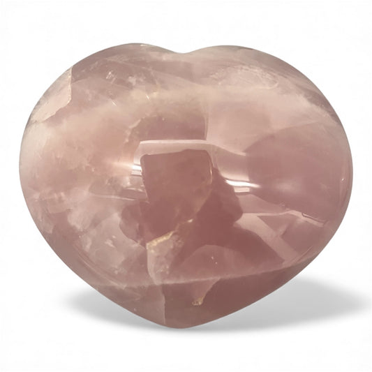 Heart-shaped rose quartz crystal on a white background