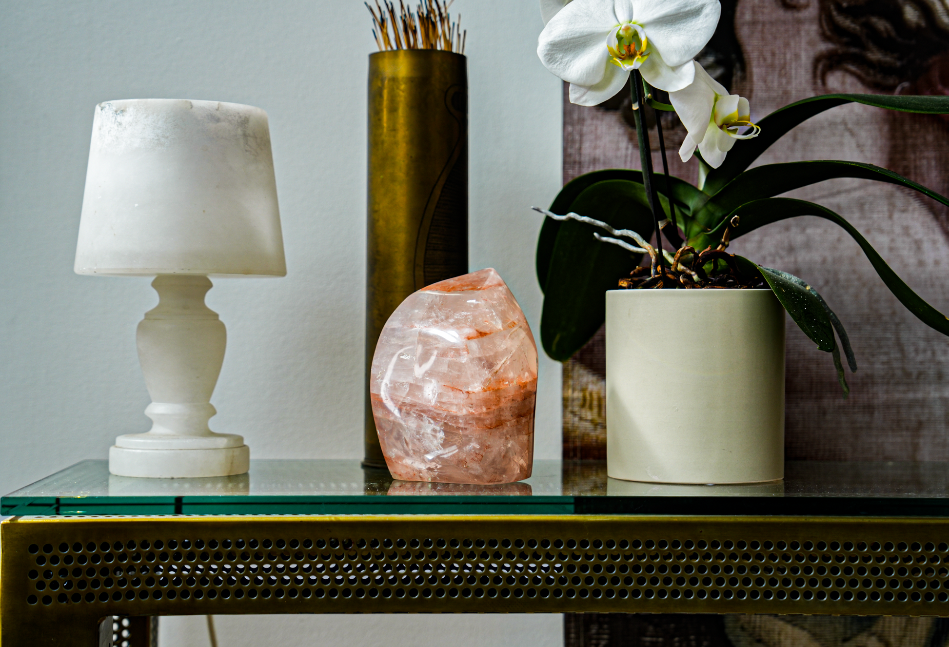 table with lamp, fire quartz free form flame and an orchid plant