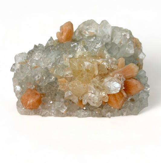 Apophyllite crystal cluster on blue chalcedony with peach stilbite blades, showcasing translucent sparkle and soft pastel mineral formations.