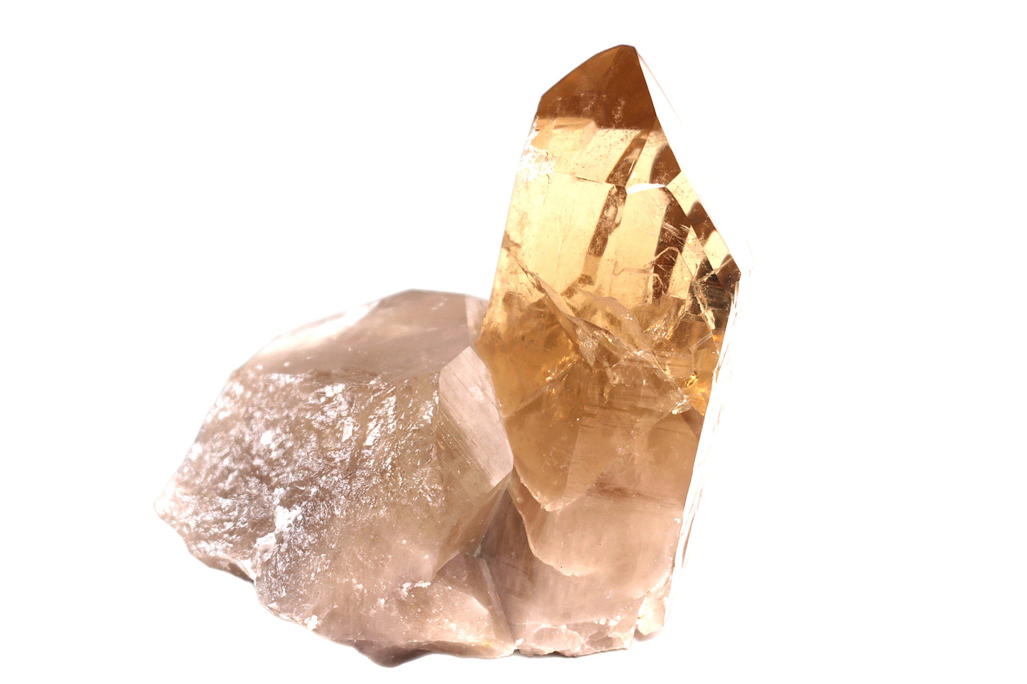 A polished, golden citrine crystal with a rough, uneven surface, isolated on a white background.
