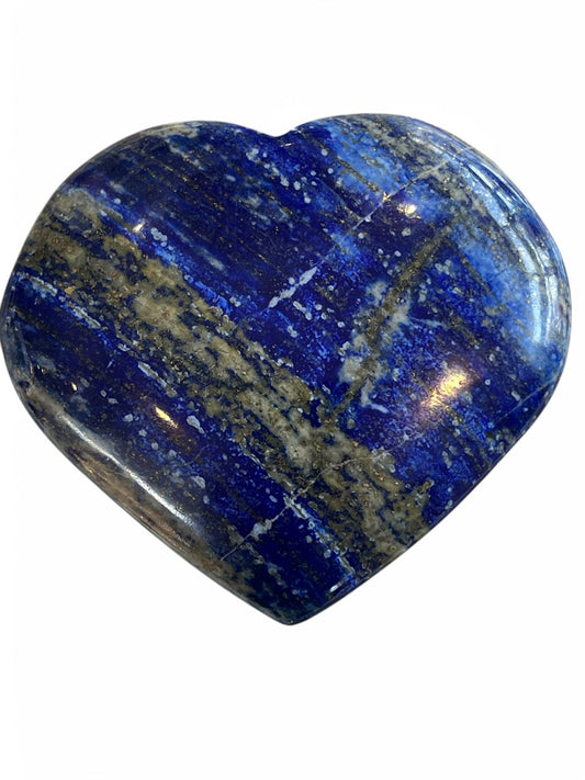 Polished Lapis Lazuli heart with deep blue tones and golden pyrite accents, styled as a small crystal décor accent.