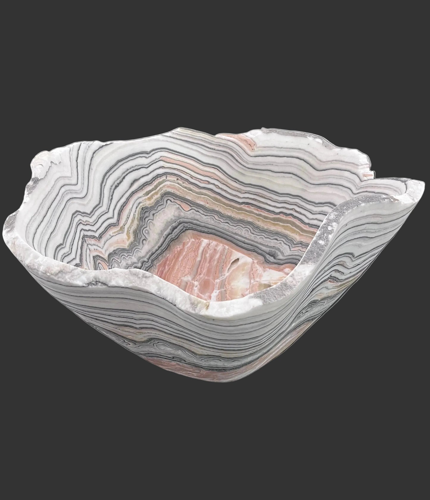 Decorative bowl with zebra calcite pattern on a black surface