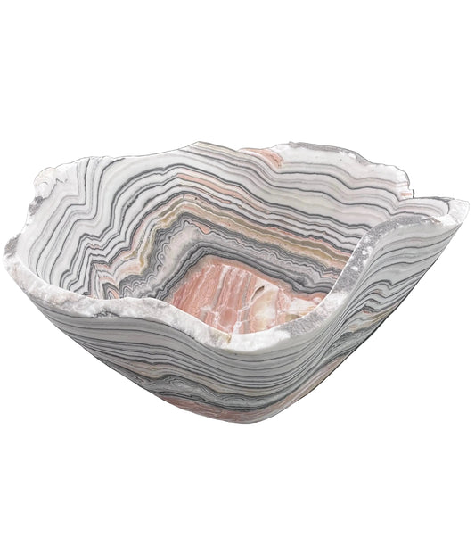 Decorative bowl with zebra calcite pattern on a black surface