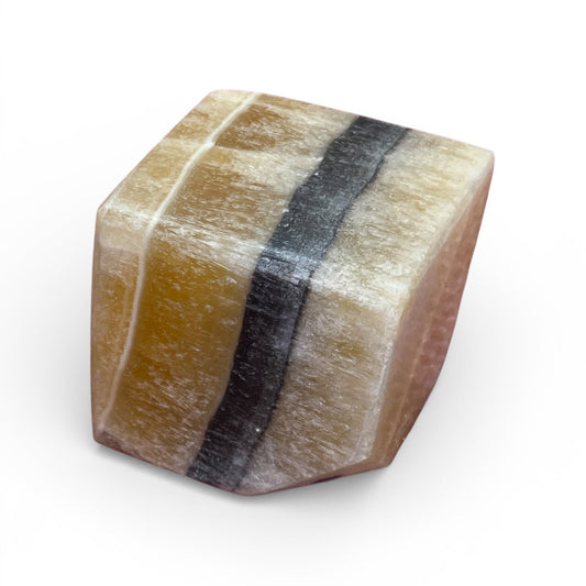 Polished stone with multicolored bands on a white background