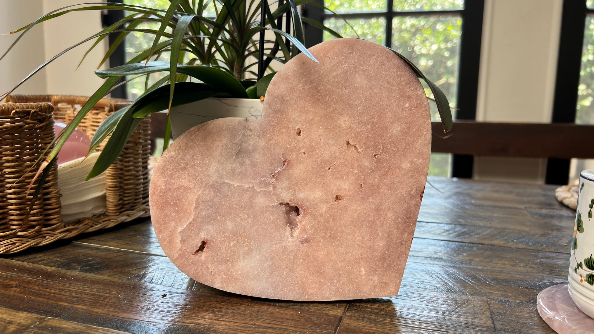 Polished Pink Amethyst heart crystal in soft blush tones, displayed as a decorative stone sculpture for modern home décor.