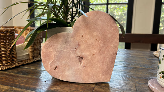 Polished Pink Amethyst heart crystal in soft blush tones, displayed as a decorative stone sculpture for modern home décor.