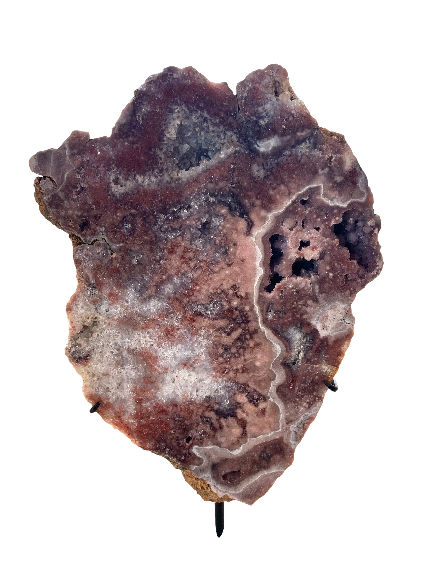 A pink amethyst slab on a stand, displaying a rough crystal texture with varying shades of purple and pink.