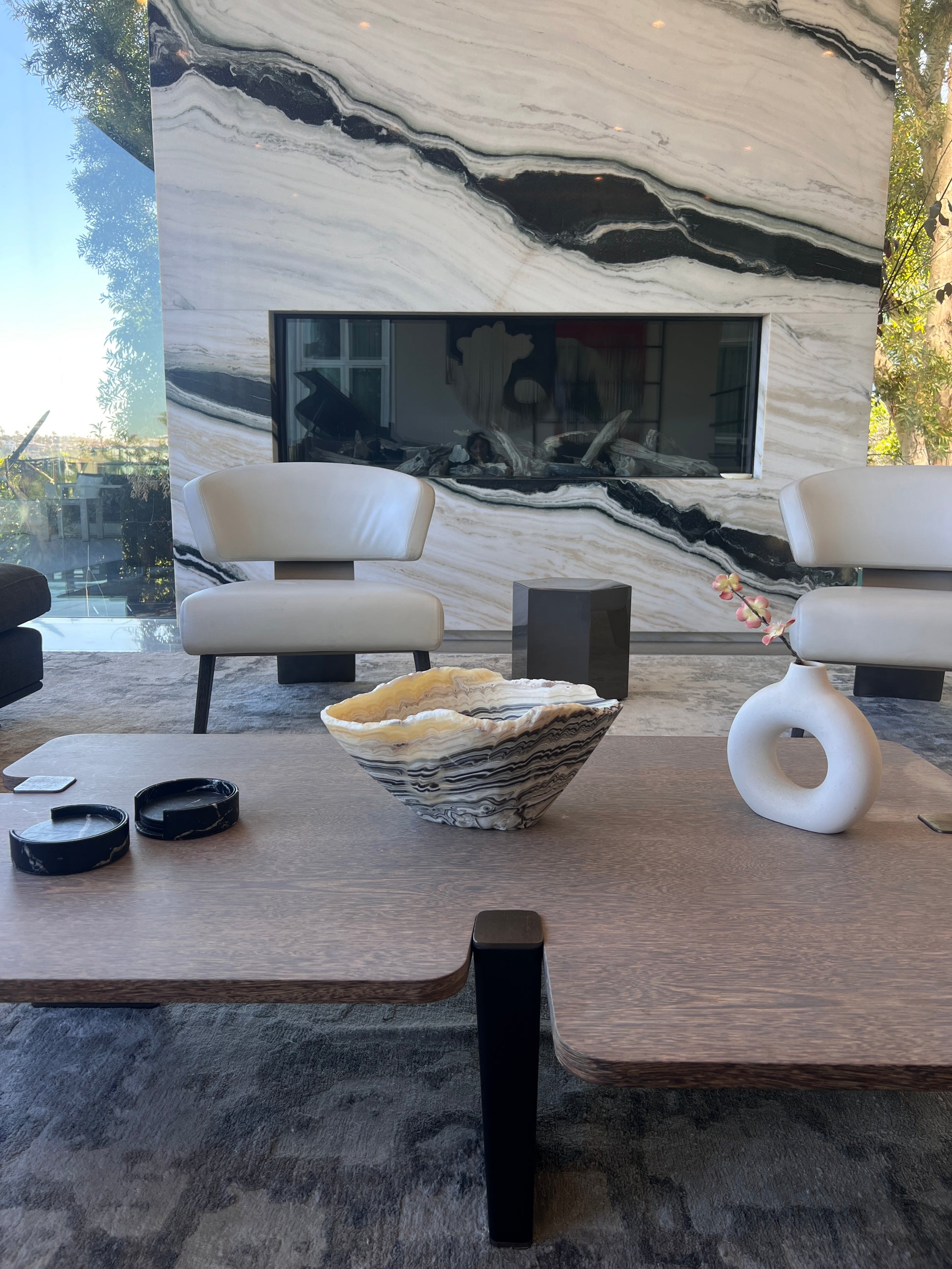 Modern living room with marble fireplace and furniture